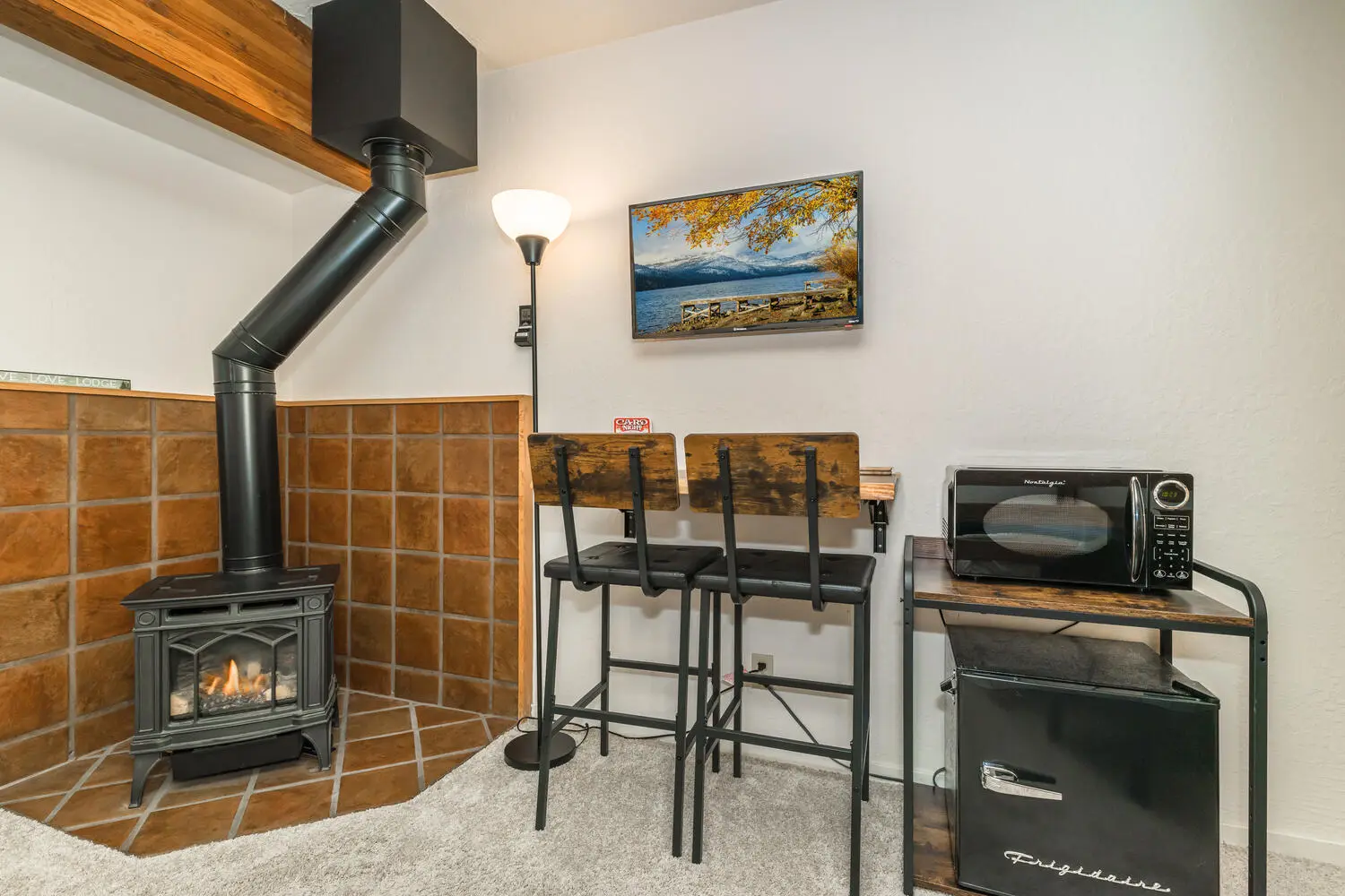 Mini-fridge, microwave, and table