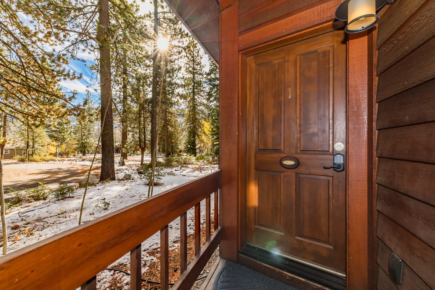 Private room entrance with snowy pines beyond